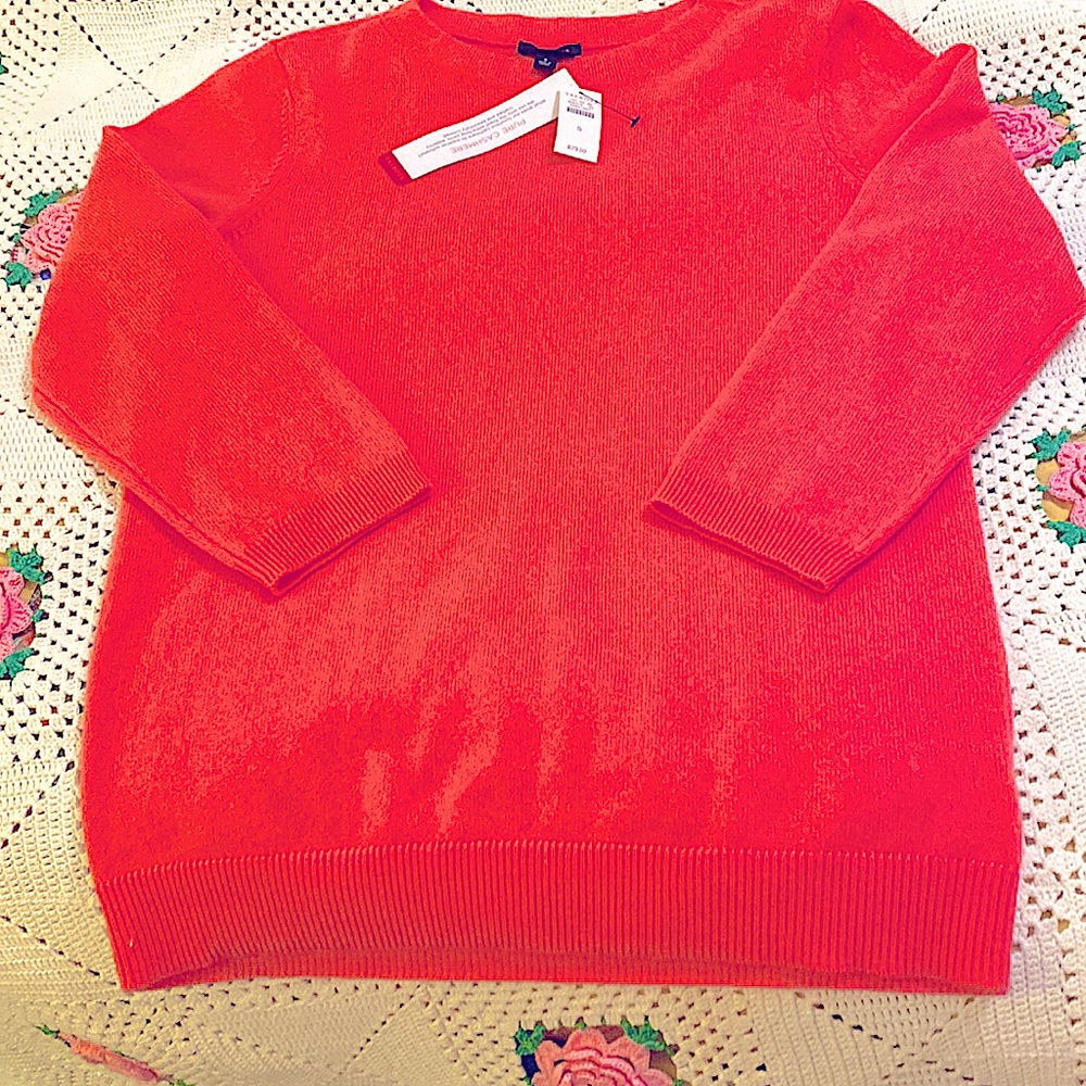 This is a pretty pinkish / lgt  salmon color .100% Cashmere sweater size S NWT
